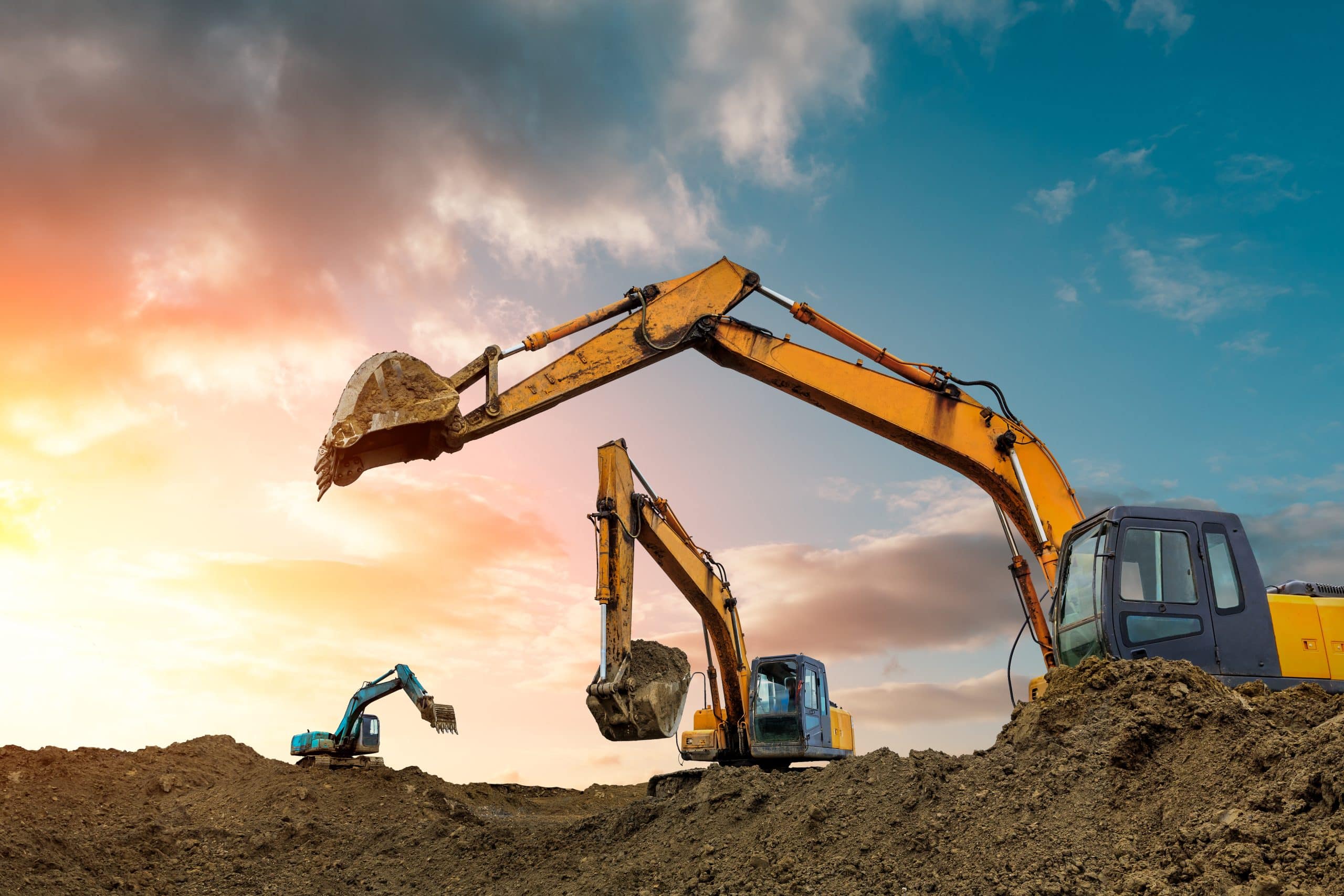 Three excavators work on construction site at sunset CIS Payroll in Scotland