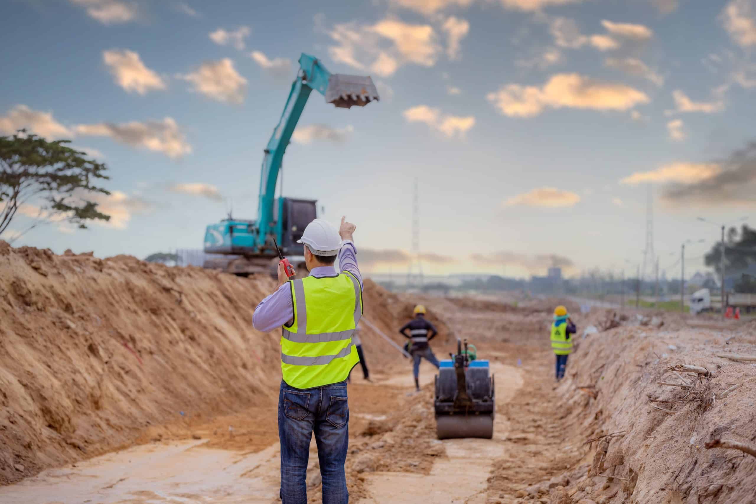 Surveyor engineer wearing safety uniform and helmet with equipme CIS Payroll In Manchester
