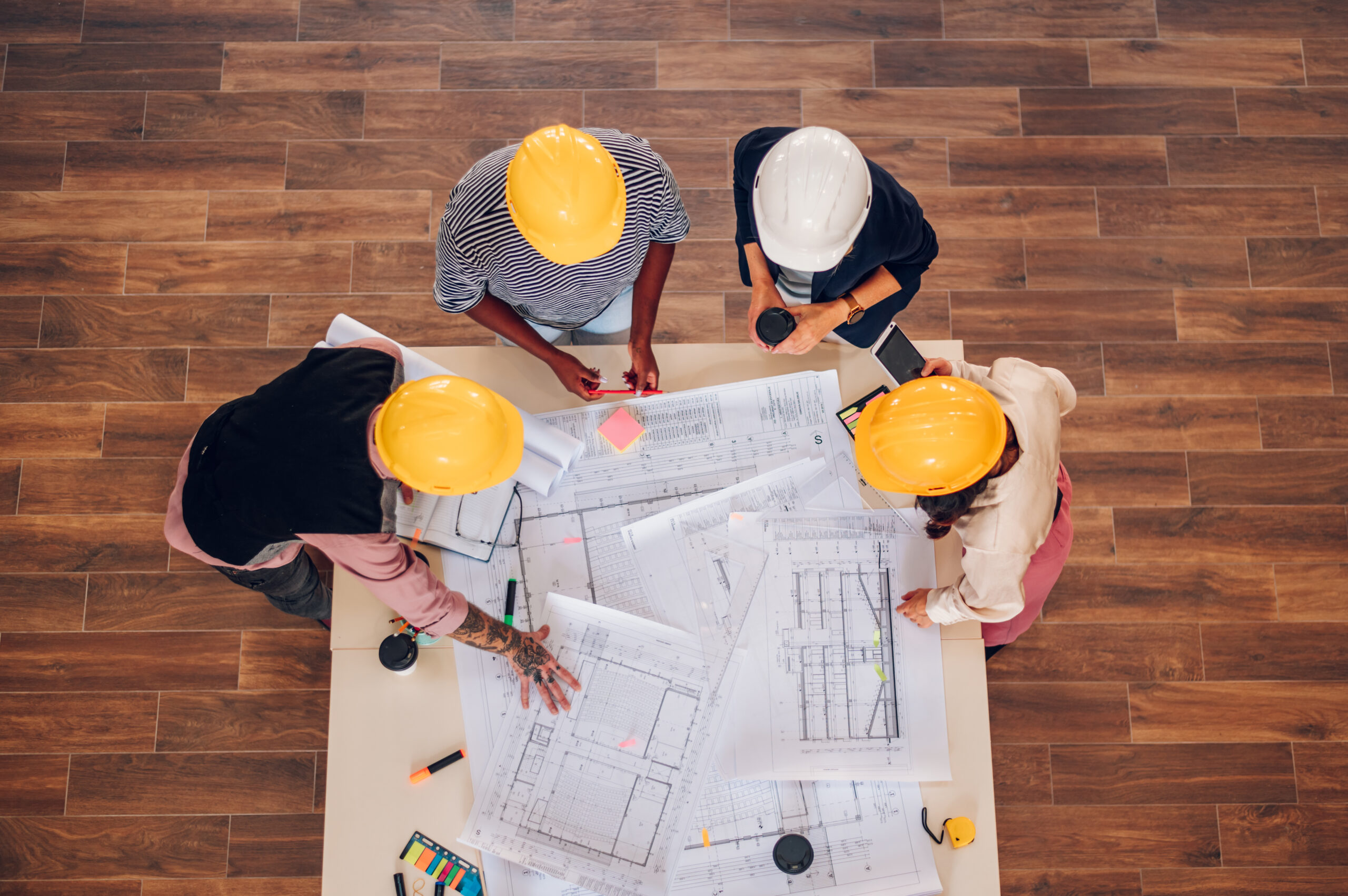 High angle shot of a multiracial team of architects having a mee