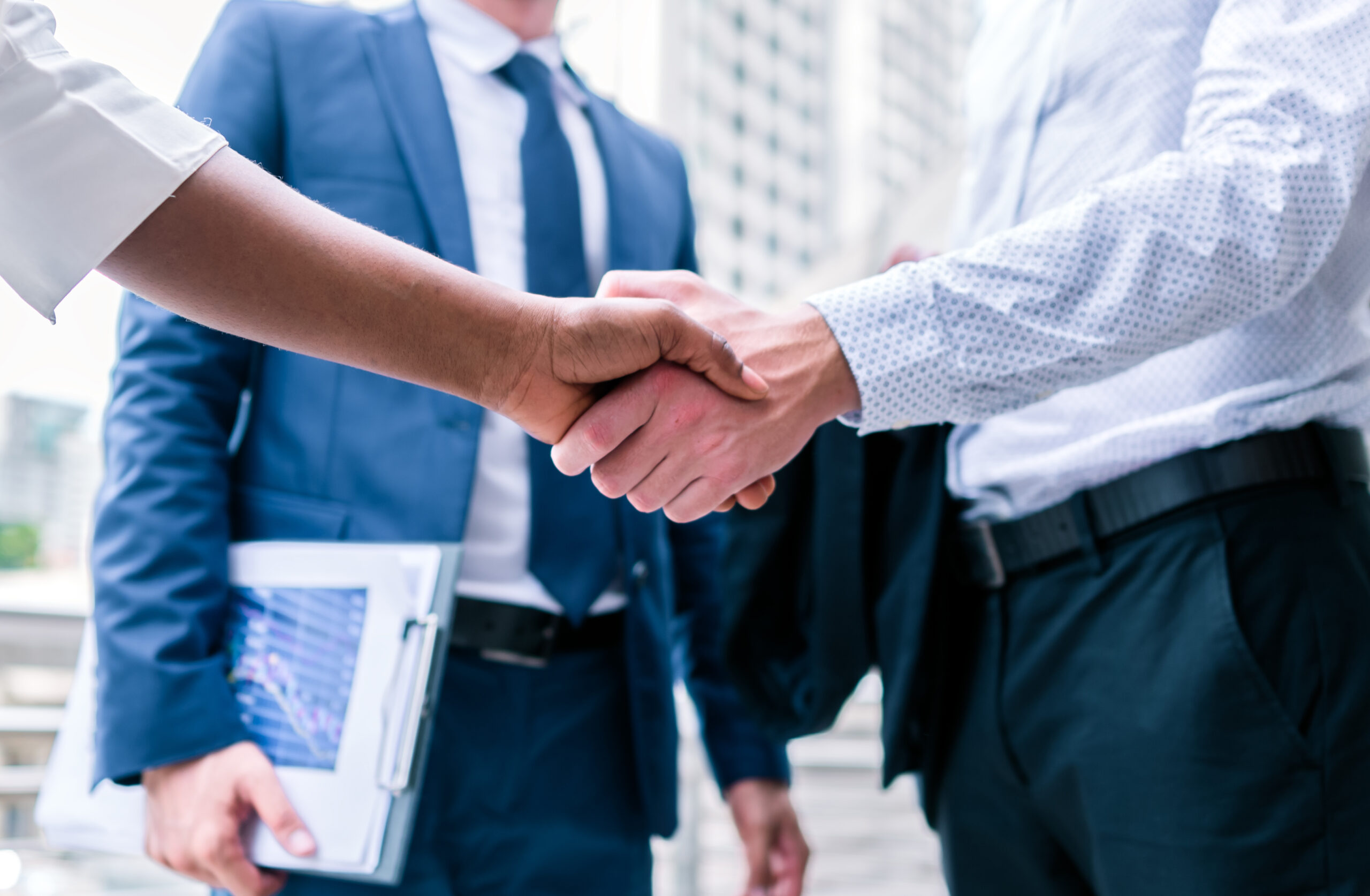 business-professionals-shaking-hands-outside-in-ur-2026-01-06-10-37-45-utc