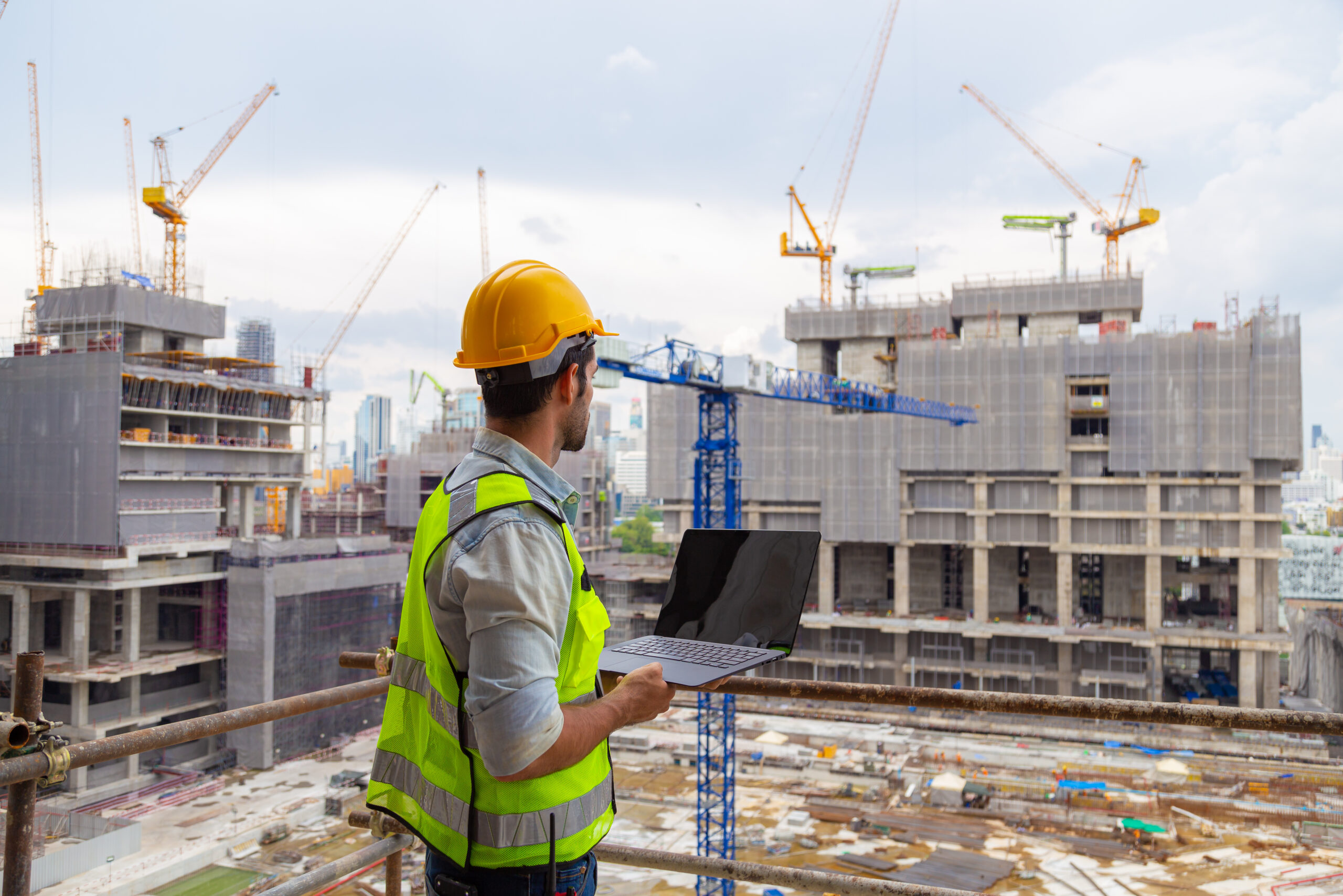 Portrait of an engineer designing a large project inspecting the