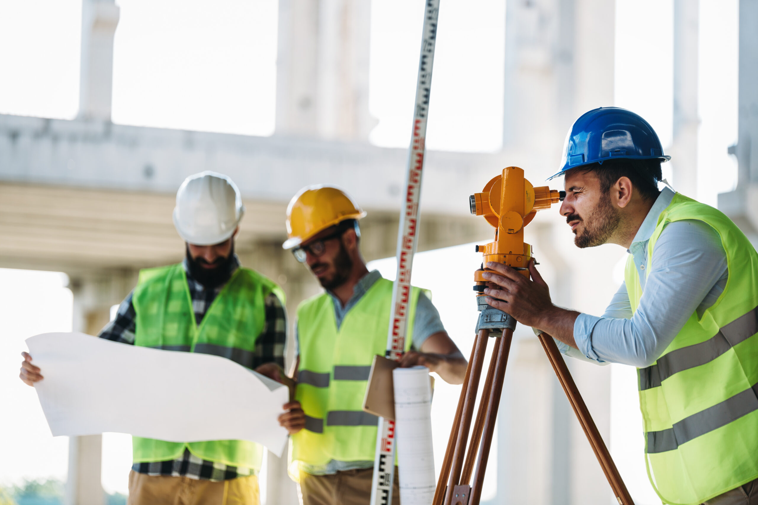 Portrait of construction engineers working on building site