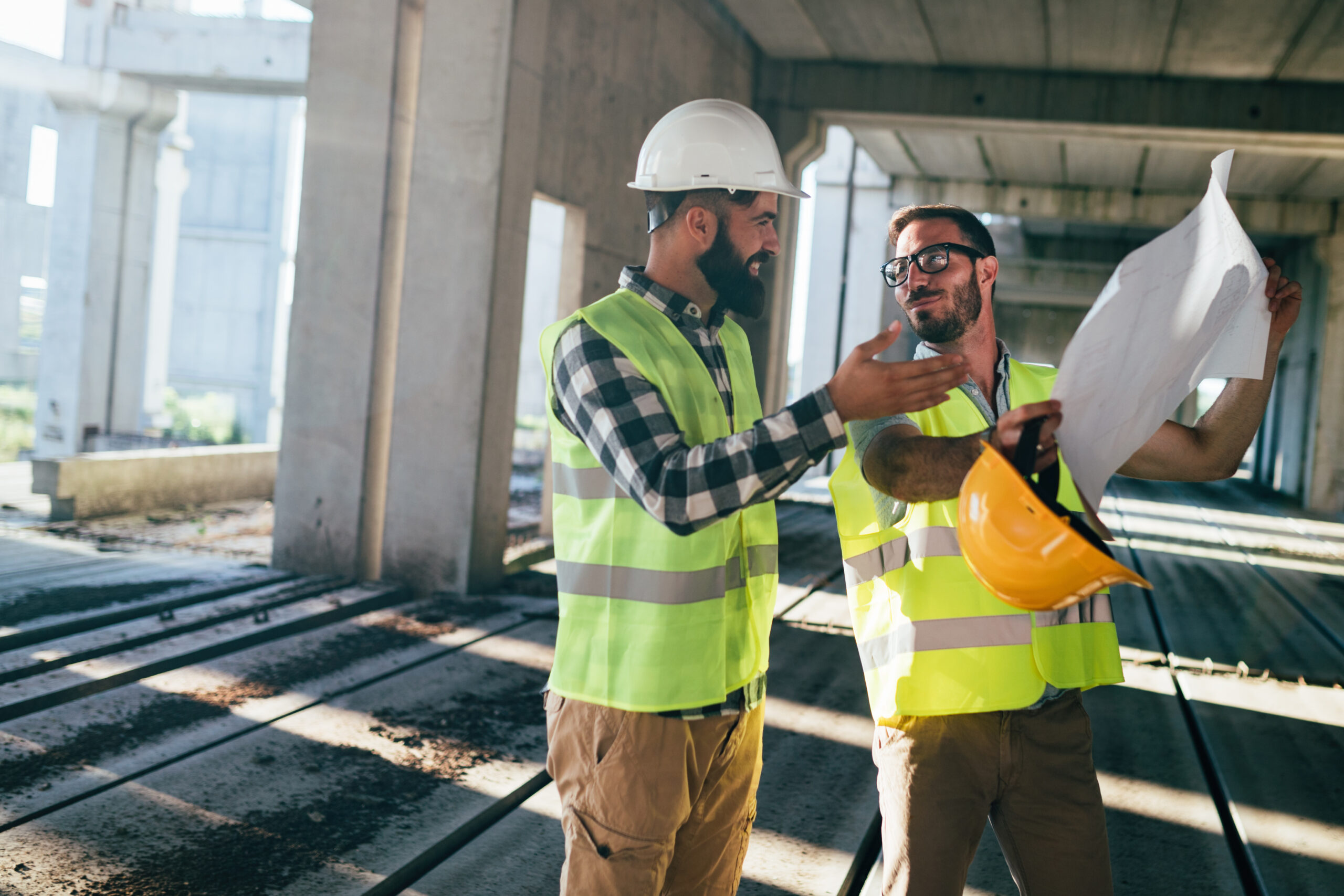 Portrait of construction engineers working on building site